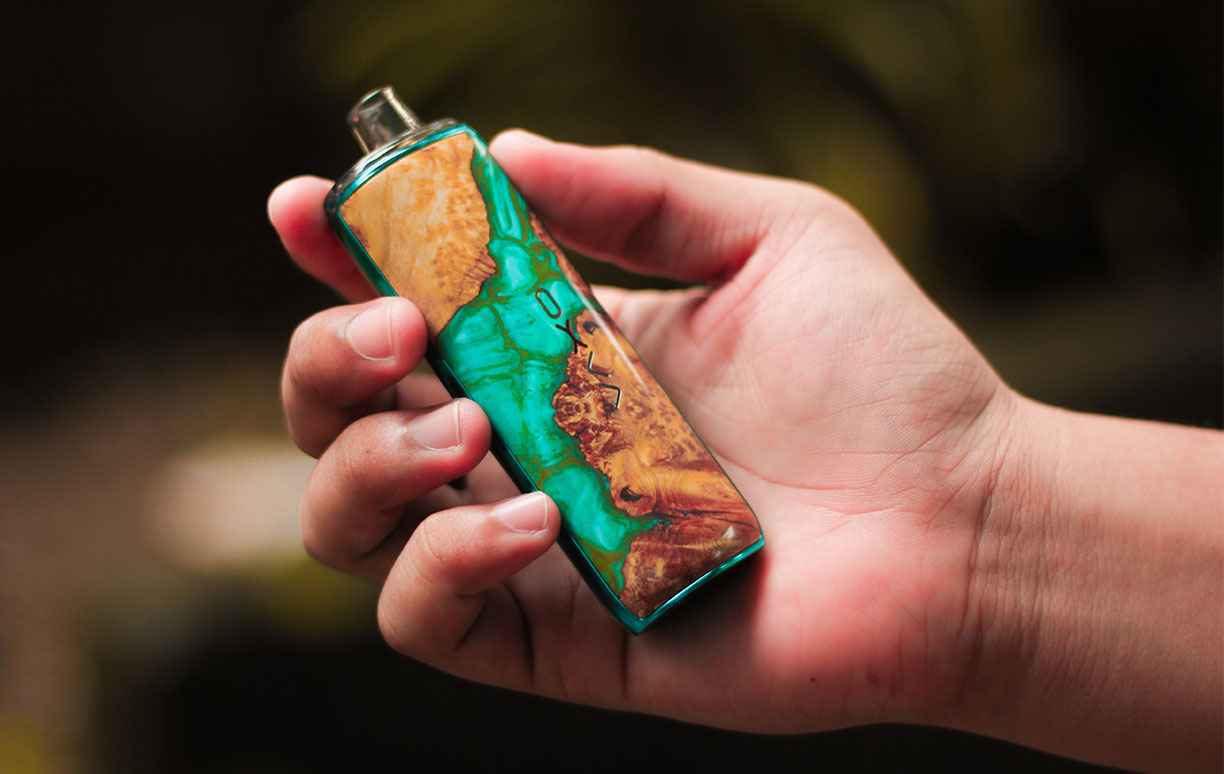Person Holding a Vape Person Holding a Vape